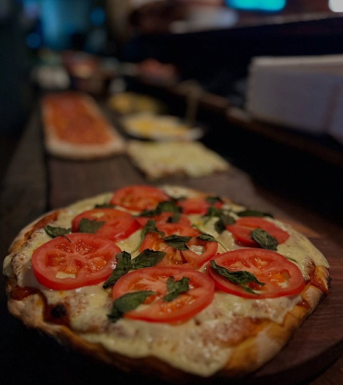 Pizza al metro de Metro Pizzería